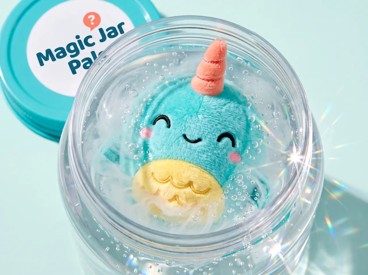 Close-up of the jar mid-reveal as the plush blooms open in the cloudy water